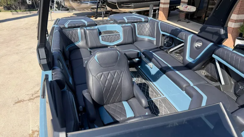 Slide: The Image of Interior of a 2022 Tigé 25ZX boat with luxurious seating. - 14
