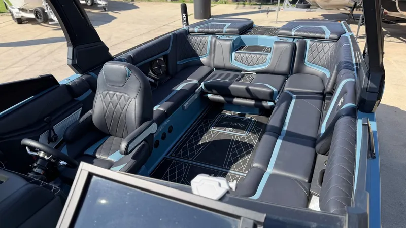 Slide: The Image of Interior of a 2022 Tigé 25ZX boat with luxurious seating. - 15