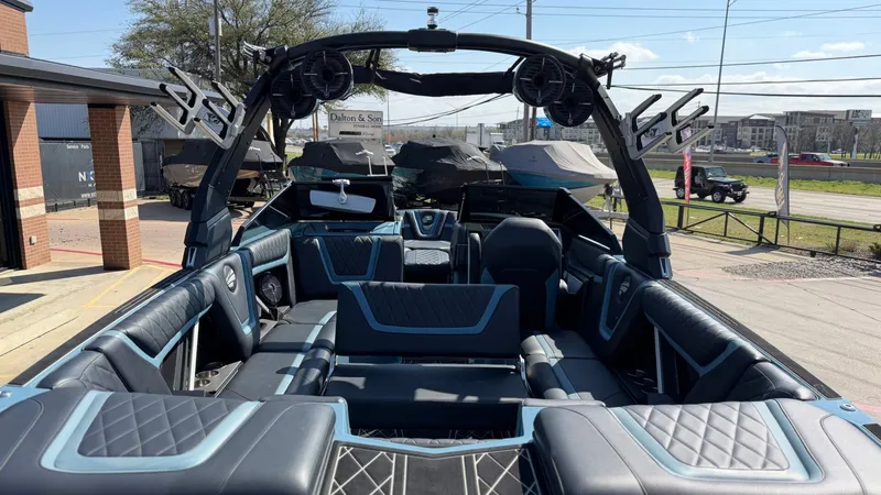 Slide: The Image of Interior of a 2022 Tigé 25ZX boat with luxurious seating. - 18