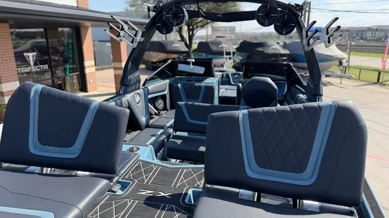 Slide: The Image of Interior of a 2022 Tigé 25ZX boat with luxurious seating. - 19