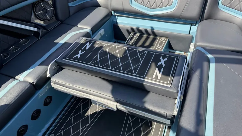 Slide: The Image of Interior of a 2022 Tigé 25ZX boat with luxurious seating. - 20