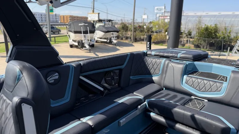 Slide: The Image of Interior of a 2022 Tigé 25ZX boat with luxurious seating. - 21