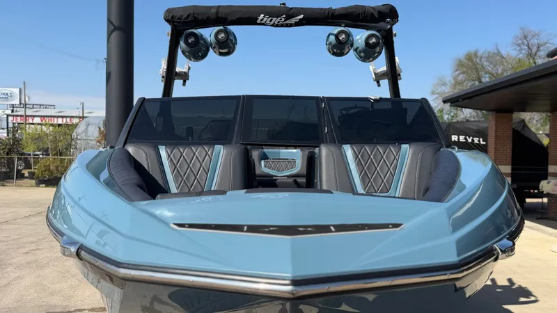 Slide: The Image of 2022 Tigé 25ZX boat with sleek design and speakers. - 8