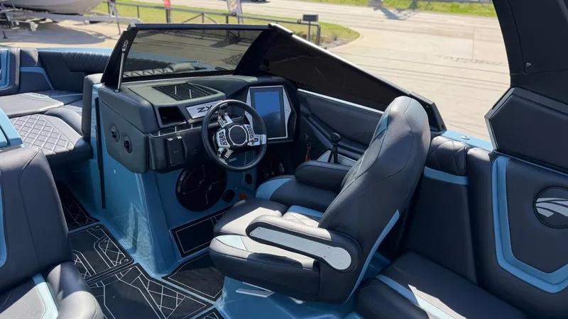 Slide: The Image of Interior of a 2022 Tigé 25ZX boat with modern cockpit. - 9