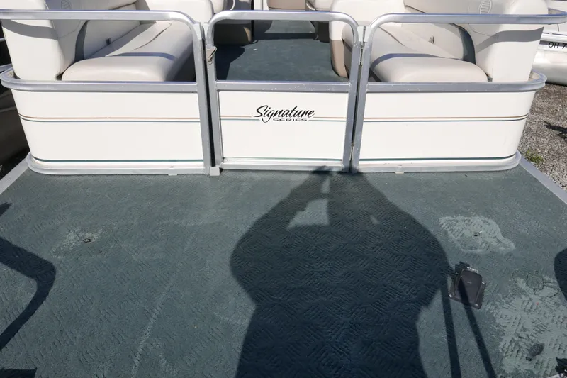 Slide: The Image of 2004 Sun Tracker Party Barge 240 pontoon boat with spacious seating and signature design. - 5