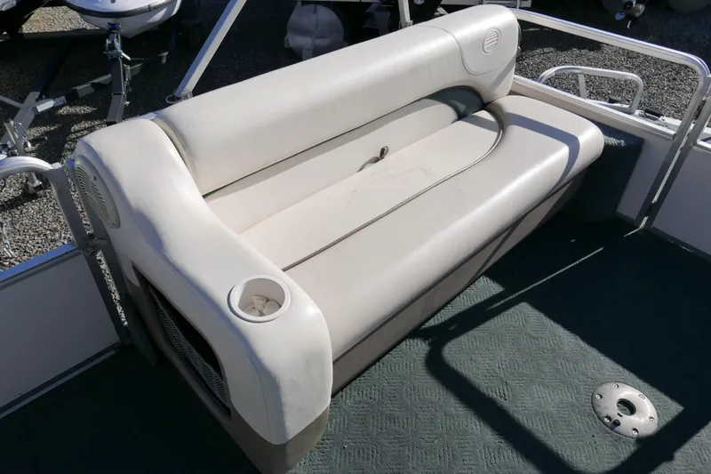 Slide: The Image of 2004 Sun Tracker Party Barge 240 boat seat with cup holder, beige upholstery. - 7