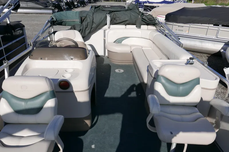 Slide: The Image of 2004 Sun Tracker Party Barge 240 pontoon boat with spacious seating and helm. - 9