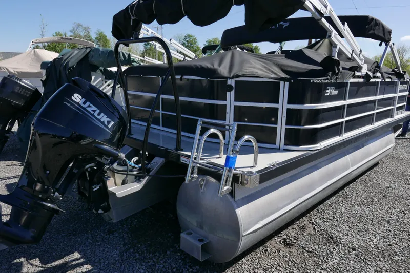 Slide: The Image of 2022 Lexington 320HPT pontoon boat with Suzuki outboard motor on gravel lot. - 3