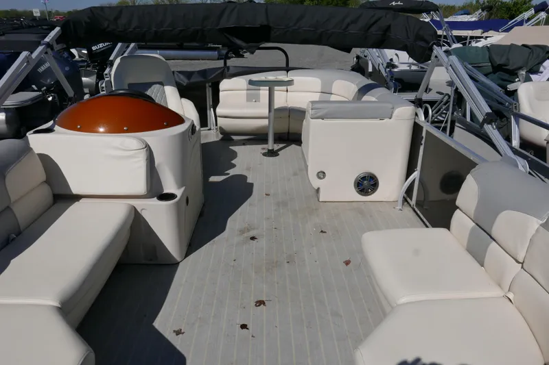 Slide: The Image of 2022 Lexington 320HPT pontoon boat interior with spacious seating and modern amenities. - 5