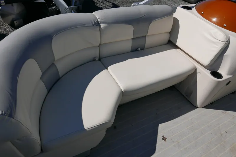 Slide: The Image of Luxurious seating on 2022 Lexington 320HPT boat, featuring plush cream upholstery. - 6