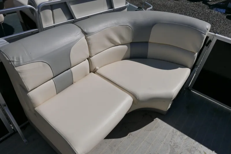 Slide: The Image of Luxurious seating on 2022 Lexington 320HPT pontoon boat, featuring plush beige upholstery. - 7