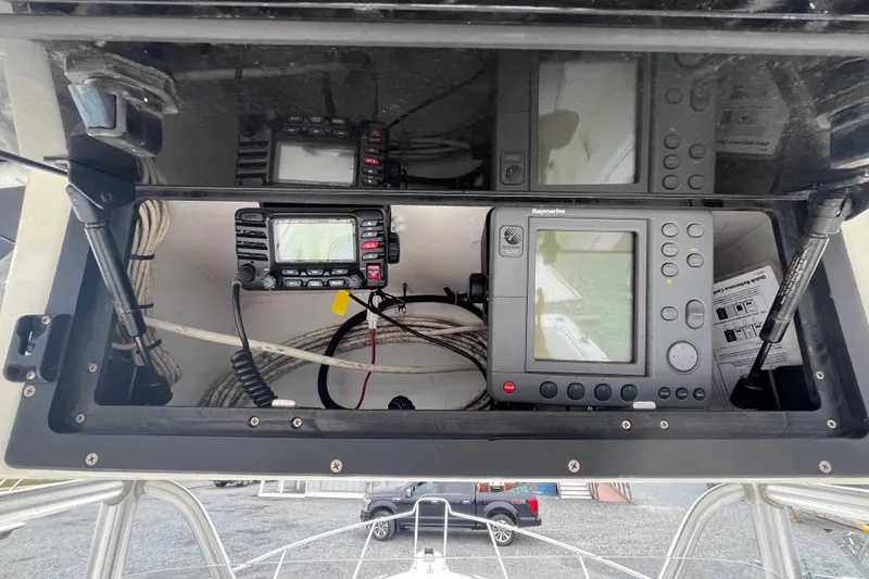 Slide: The Image of 2002 Hydra-Sports 230 CC boat dashboard with navigation and communication equipment. - 11