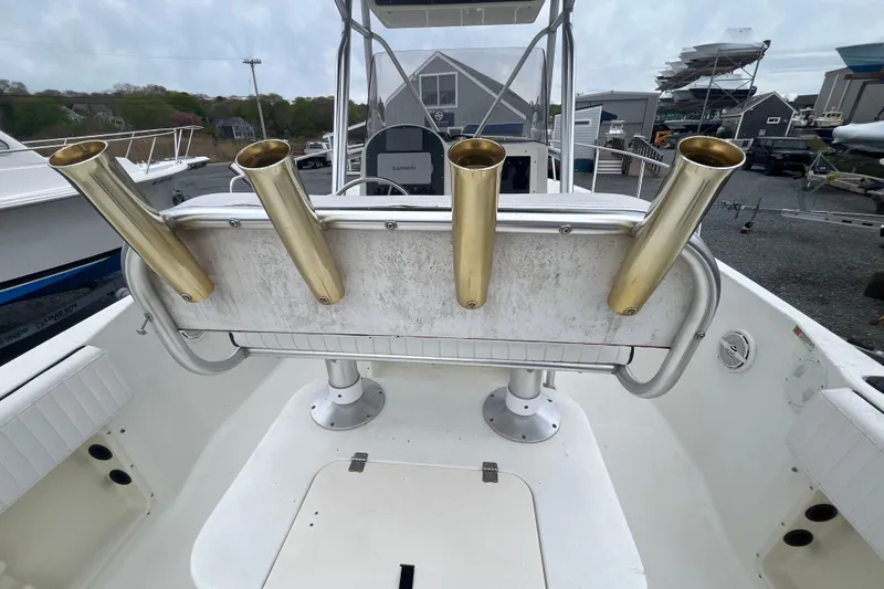 Slide: The Image of 2002 Hydra-Sports 230 CC boat with gold rod holders and white interior. - 15
