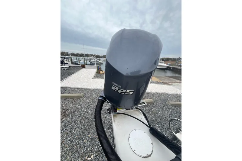 Slide: The Image of Outboard motor on 2002 Hydra-Sports 230 CC boat at marina. - 16