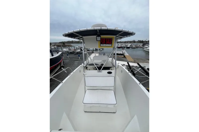 Slide: The Image of 2002 Hydra-Sports 230 CC boat for sale at marina, overcast sky. - 22