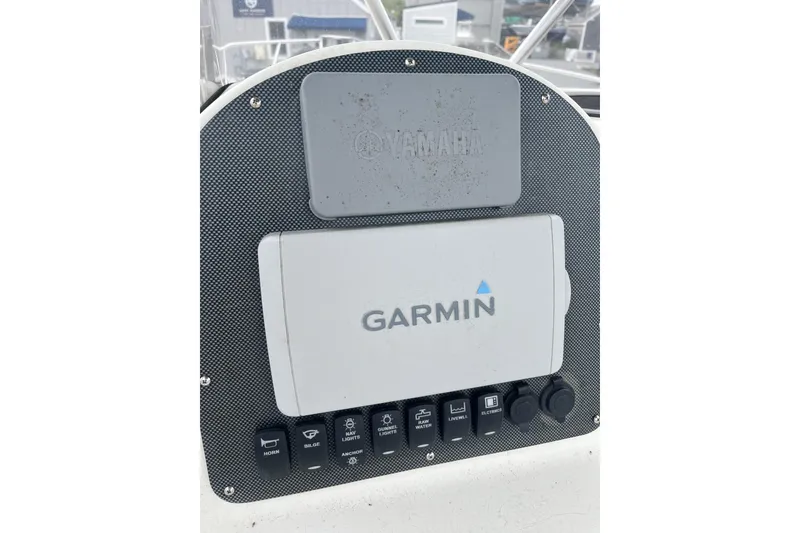 Slide: The Image of Control panel of a 2002 Hydra-Sports 230 CC boat with Garmin and Yamaha equipment. - 5
