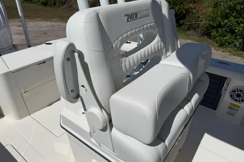 Slide: The Image of 2026 Pathfinder 2400 Open boat seat with white upholstery and armrest detail. - 14