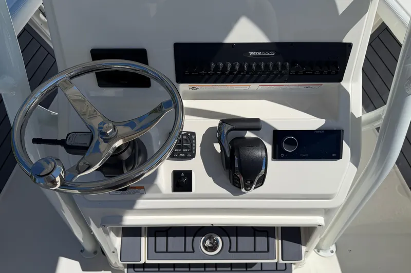 Slide: The Image of Steering console of 2026 Pathfinder 2400 Open boat with controls and navigation system. - 15