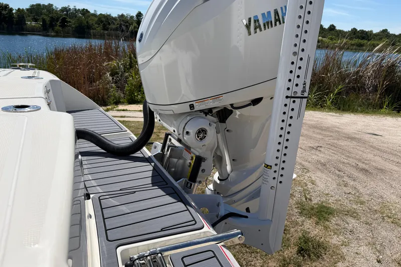 Slide: The Image of 2026 Pathfinder 2400 Open boat with Yamaha outboard motor by a lake. - 6