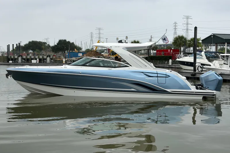 The Image of 2026 Formula 360 Crossover Bowrider OB on display, featuring sleek design and powerful outboard engines. - 0