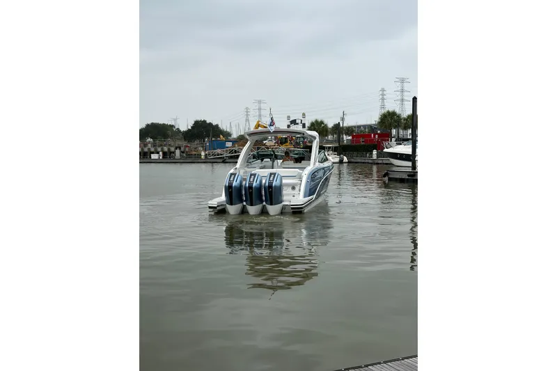 Slide: The Image of 2026 Formula 360 Crossover Bowrider OB cruising in a marina, showcasing sleek design and powerful engines. - 11