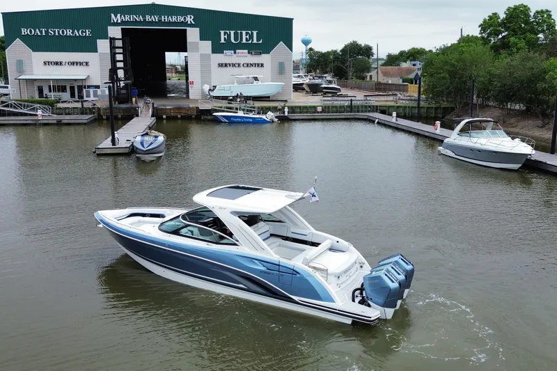 Slide: The Image of 2026 Formula 360 Crossover Bowrider OB at marina, showcasing sleek design and powerful engines. - 17
