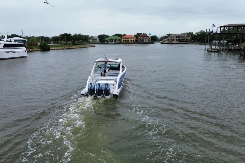 Slide: The Image of 2026 Formula 360 Crossover Bowrider OB cruising on a scenic waterway. - 23