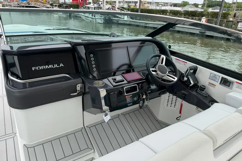 Slide: The Image of 2026 Formula 360 Crossover Bowrider OB helm with modern controls and sleek design. - 29