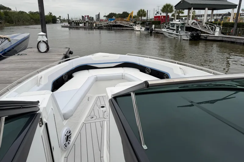 Slide: The Image of 2026 Formula 360 Crossover Bowrider OB docked, showcasing spacious seating and sleek design. - 32