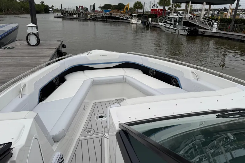 Slide: The Image of 2026 Formula 360 Crossover Bowrider OB docked, showcasing spacious seating and sleek design. - 33