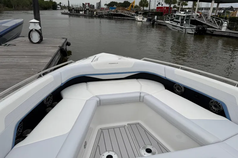 Slide: The Image of 2026 Formula 360 Crossover Bowrider OB at dock, showcasing spacious seating and sleek design. - 36