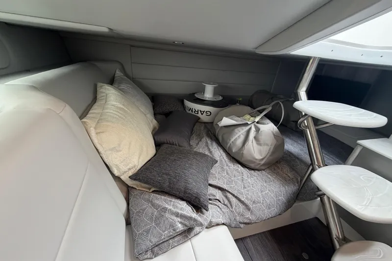 Slide: The Image of Cozy cabin interior of 2026 Formula 360 Crossover Bowrider OB with pillows and storage. - 39