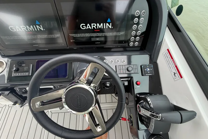 Slide: The Image of Steering console of 2026 Formula 360 Crossover Bowrider OB with Garmin navigation displays. - 40
