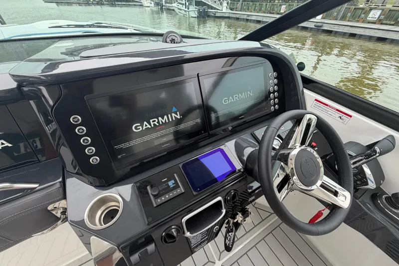 Slide: The Image of 2026 Formula 360 Crossover Bowrider OB helm with dual Garmin displays and sleek steering wheel. - 41