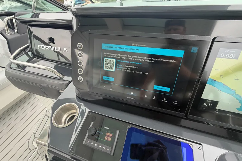 Slide: The Image of 2026 Formula 360 Crossover Bowrider OB dashboard with Seakeeper and Garmin displays. - 43
