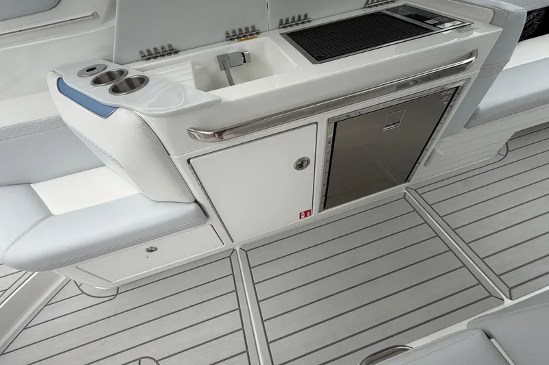 Slide: The Image of 2026 Formula 360 Crossover Bowrider OB interior with sink, grill, and refrigerator. - 47
