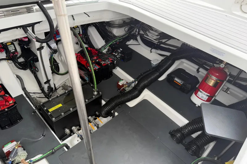 Slide: The Image of Engine compartment of 2026 Formula 360 Crossover Bowrider OB, showcasing wiring and components. - 55