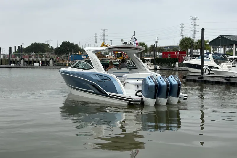 Slide: The Image of 2026 Formula 360 Crossover Bowrider OB in marina, featuring triple outboard engines. - 9