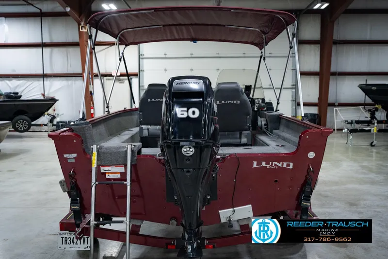 Slide: The Image of 2017 Lund 1650 Rebel XS SS boat with Mercury 60 engine in indoor showroom. - 10