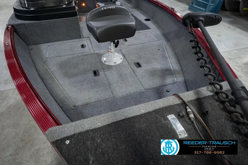 Slide: The Image of 2017 Lund 1650 Rebel XS SS boat interior with seating and storage compartments. - 15