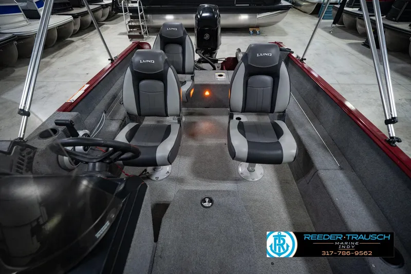 Slide: The Image of 2017 Lund 1650 Rebel XS SS boat interior with dual seats and steering console. - 25