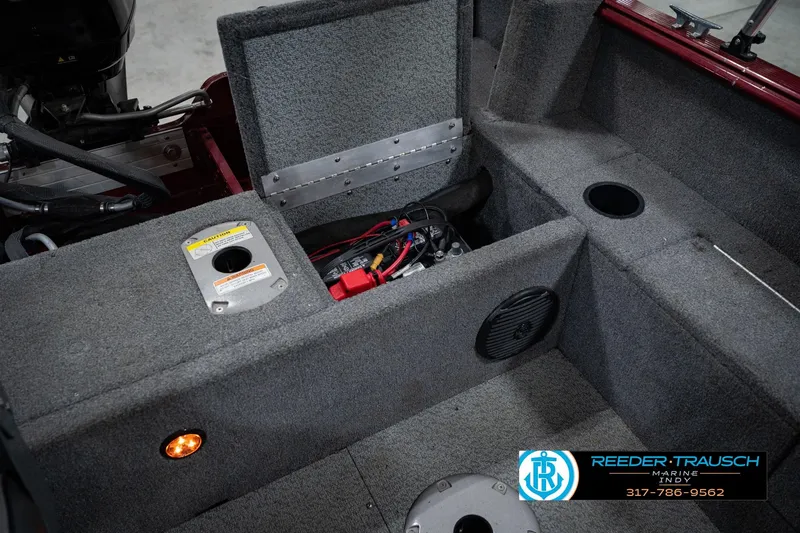 Slide: The Image of 2017 Lund 1650 Rebel XS SS boat interior with storage compartments and wiring. - 29