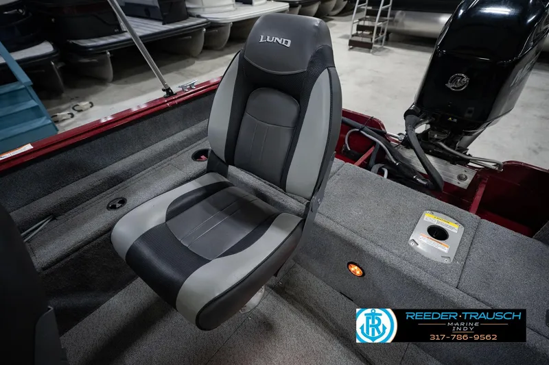Slide: The Image of 2017 Lund 1650 Rebel XS SS boat interior with gray seat and motor. - 30