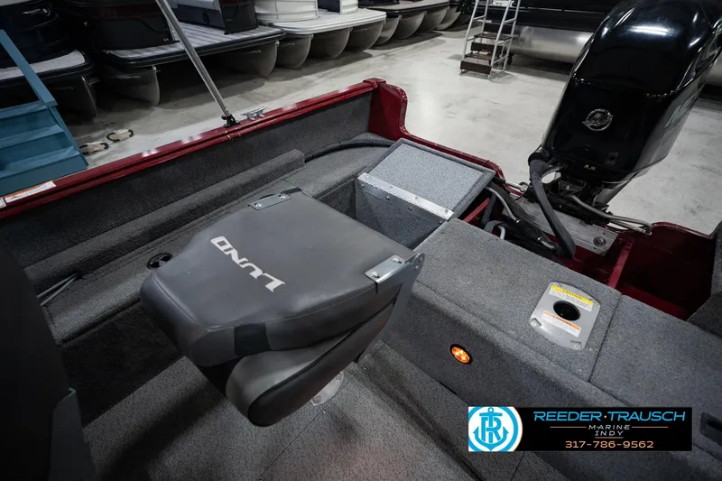 Slide: The Image of 2017 Lund 1650 Rebel XS SS boat interior with motor and seating. - 33