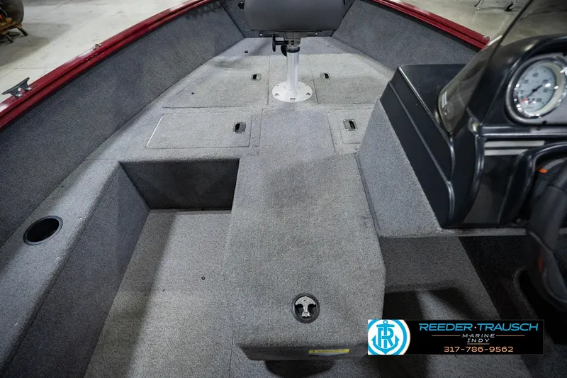 Slide: The Image of 2017 Lund 1650 Rebel XS SS boat interior with gray carpet and seating. - 36