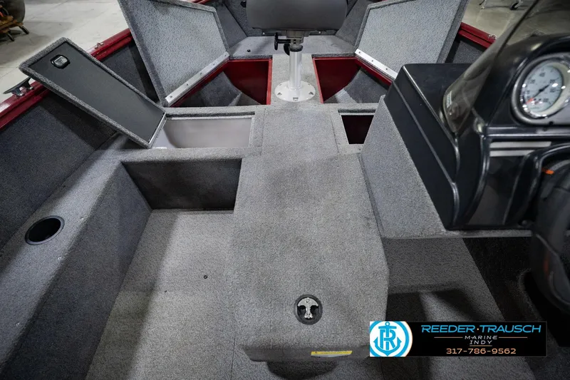 Slide: The Image of 2017 Lund 1650 Rebel XS SS boat interior with storage compartments and seating. - 37