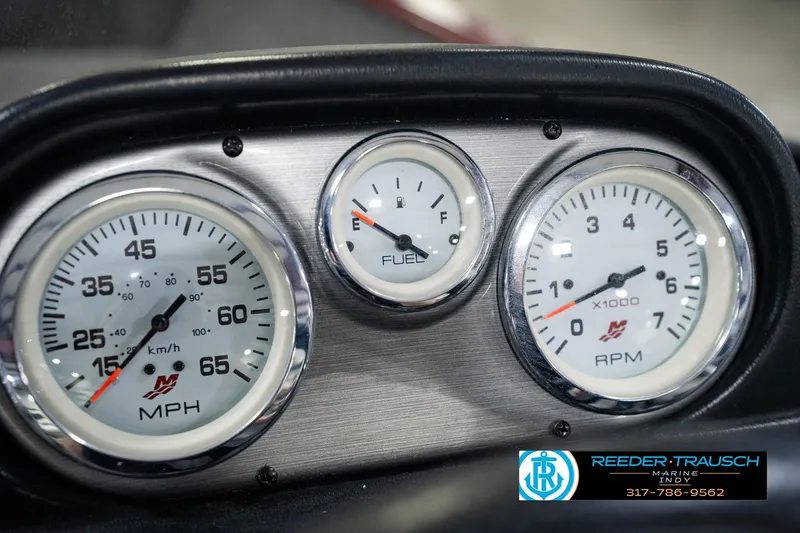 Slide: The Image of Dashboard of a 2017 Lund 1650 Rebel XS SS boat showing speedometer, fuel gauge, and tachometer. - 42