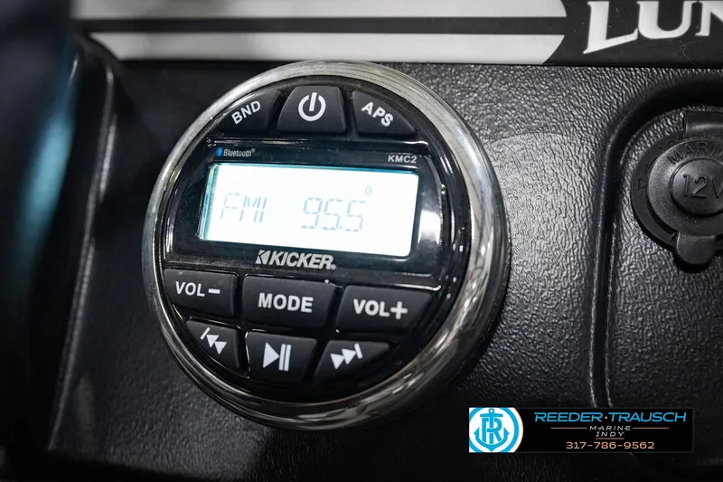 Slide: The Image of Close-up of Kicker stereo system on 2017 Lund 1650 Rebel XS SS boat dashboard. - 43