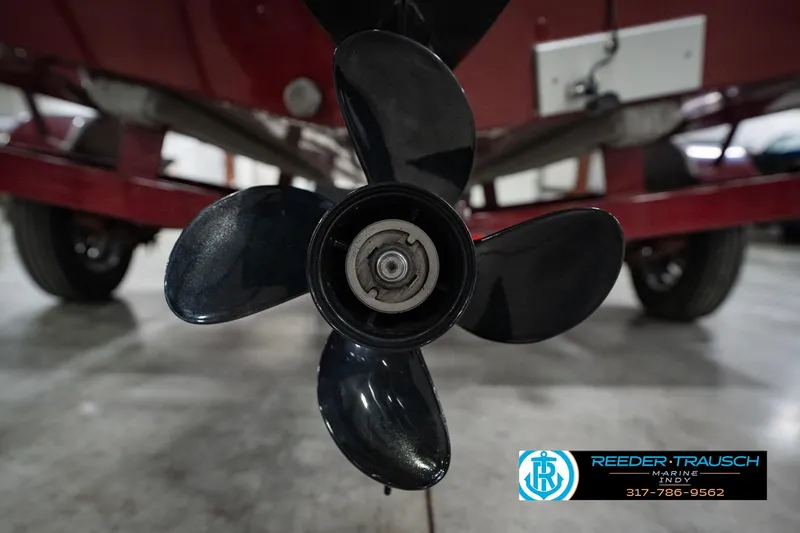 Slide: The Image of Close-up of a 2017 Lund 1650 Rebel XS SS boat propeller in a garage setting. - 52