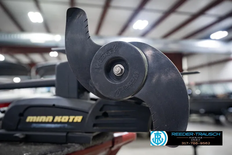 Slide: The Image of Minn Kota motor propeller on a 2017 Lund 1650 Rebel XS SS boat in a showroom. - 56